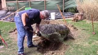 Moving a big rock with a hand truck a lawn tractor and a willing wife [upl. by Aynnat]