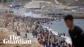 Migrants met by Spanish military as they swim to north African enclave Ceuta [upl. by Valaria]